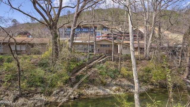 back of house featuring a water view