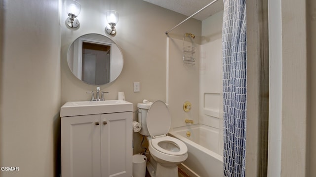 bathroom featuring toilet, vanity, and shower / washtub combination