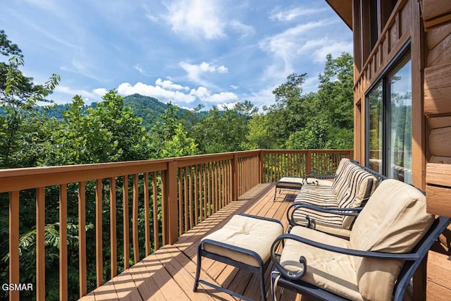 wooden deck with an outdoor hangout area