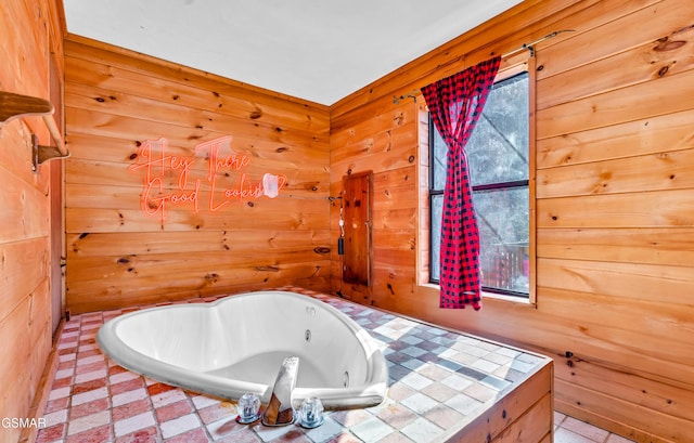 bathroom with a bathing tub and wooden walls