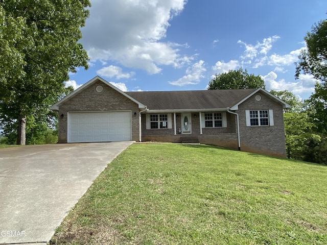 ranch-style home with driveway, brick siding, a front yard, and an attached garage