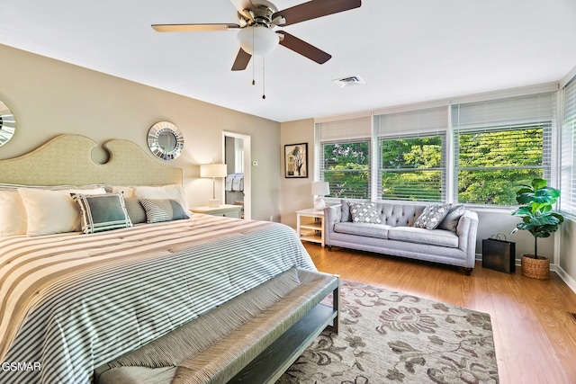 bedroom featuring ceiling fan and light hardwood / wood-style flooring