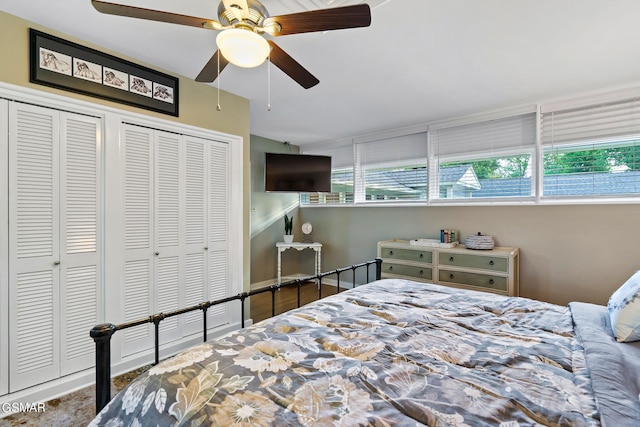 bedroom featuring two closets and ceiling fan