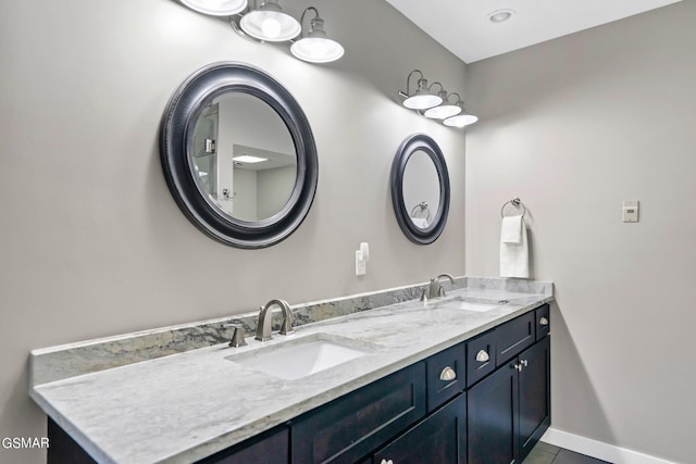 bathroom with tile patterned flooring and vanity