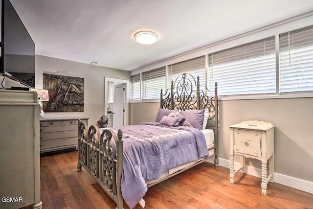 bedroom with wood-type flooring