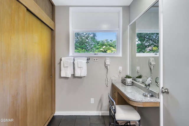 bathroom with tile patterned flooring and vanity