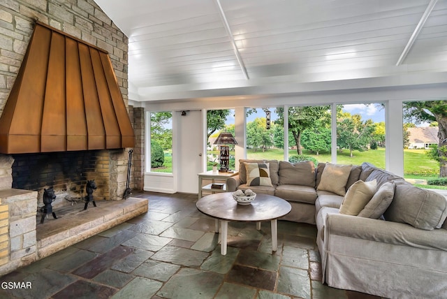 sunroom / solarium with a large fireplace