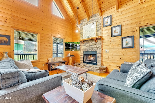 living room featuring wooden walls, a fireplace, wood ceiling, and wood finished floors