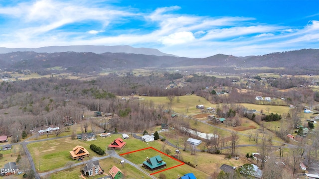 aerial view featuring a rural view and a mountain view