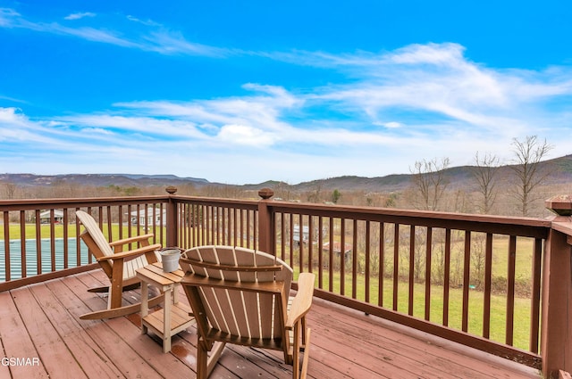 wooden terrace featuring a mountain view