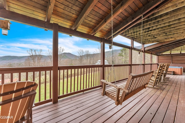 wooden deck featuring a mountain view