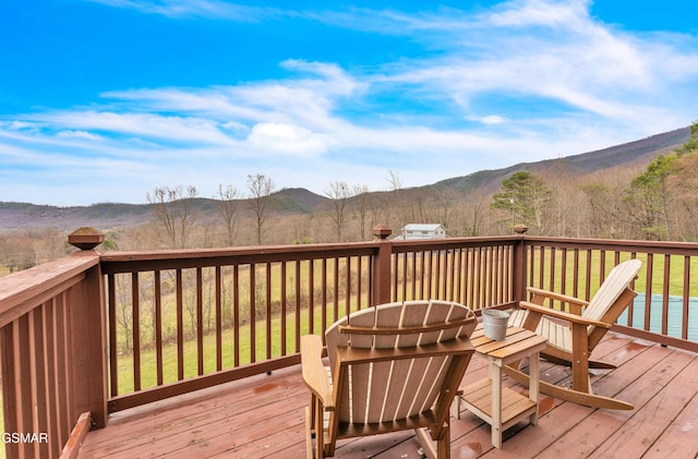 wooden deck with a mountain view