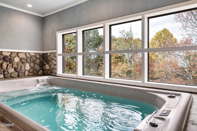 view of swimming pool with a hot tub