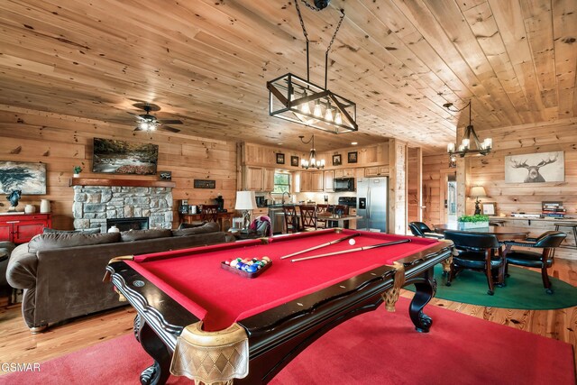 rec room featuring a stone fireplace, wooden ceiling, and billiards