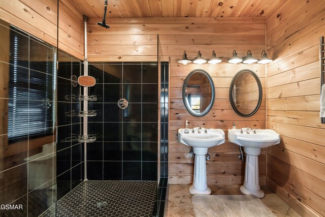 bathroom with double sink, wooden walls, tile patterned floors, and wooden ceiling