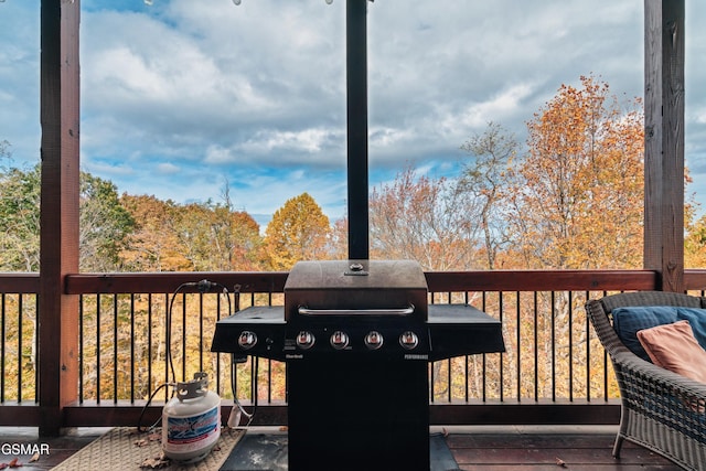 wooden terrace with area for grilling