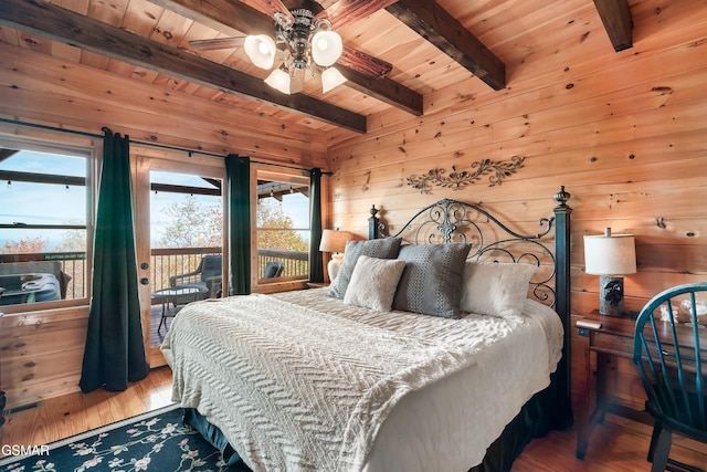 bedroom featuring multiple windows, beamed ceiling, and wood ceiling