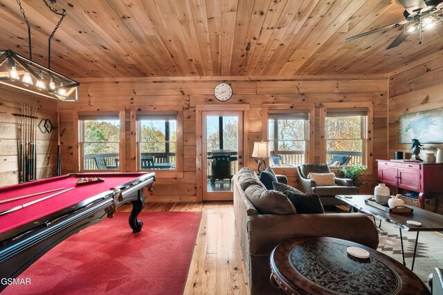 rec room with a healthy amount of sunlight, wooden walls, wood ceiling, and billiards