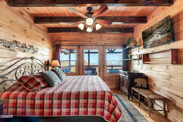 bedroom featuring wooden walls, wooden ceiling, beamed ceiling, and access to outside