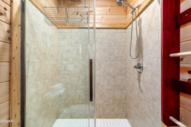 bathroom featuring a shower with shower door