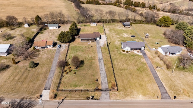 birds eye view of property with a rural view