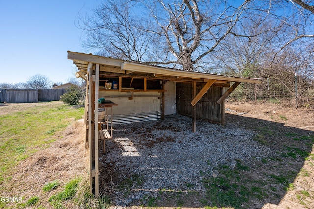 view of yard featuring an outbuilding and an exterior structure