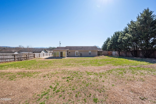 view of yard featuring a fenced backyard