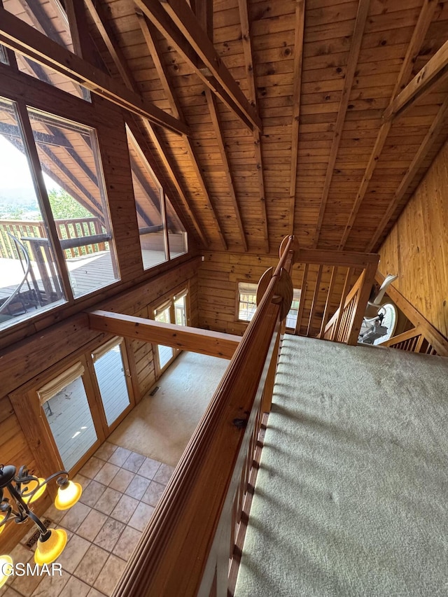 2452 Skyview Way, Dandridge, TN 37725 - staircase with wood walls, wooden ceiling, plenty of natural light, and tile patterned flooring