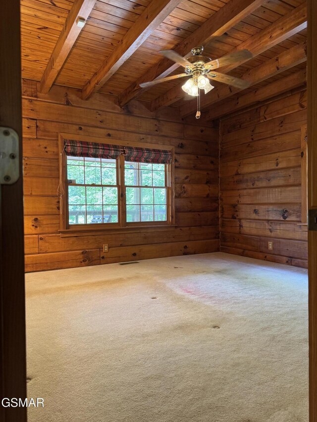 2452 Skyview Way, Dandridge, TN 37725 - spare room with wooden walls, carpet flooring, wood ceiling with exposed beams, and a ceiling fan