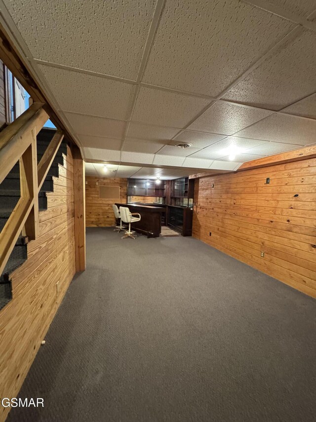 2452 Skyview Way, Dandridge, TN 37725 - finished below grade area with wood walls, stairs, carpet flooring, a paneled ceiling, and a bar