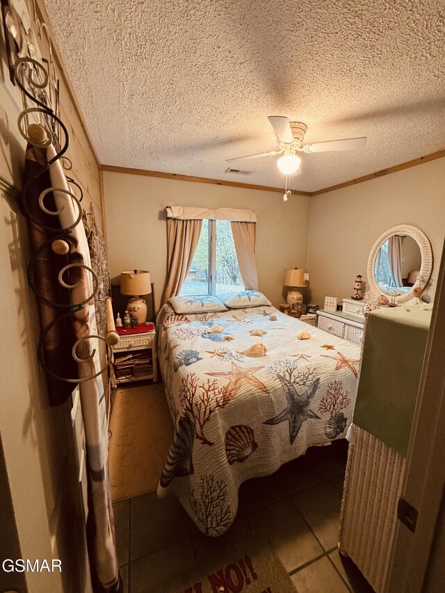 2452 Skyview Way, Dandridge, TN 37725 - tiled bedroom featuring ornamental molding, a ceiling fan, and a textured ceiling