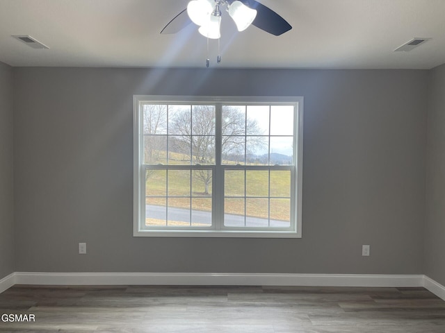 spare room featuring ceiling fan and wood-type flooring