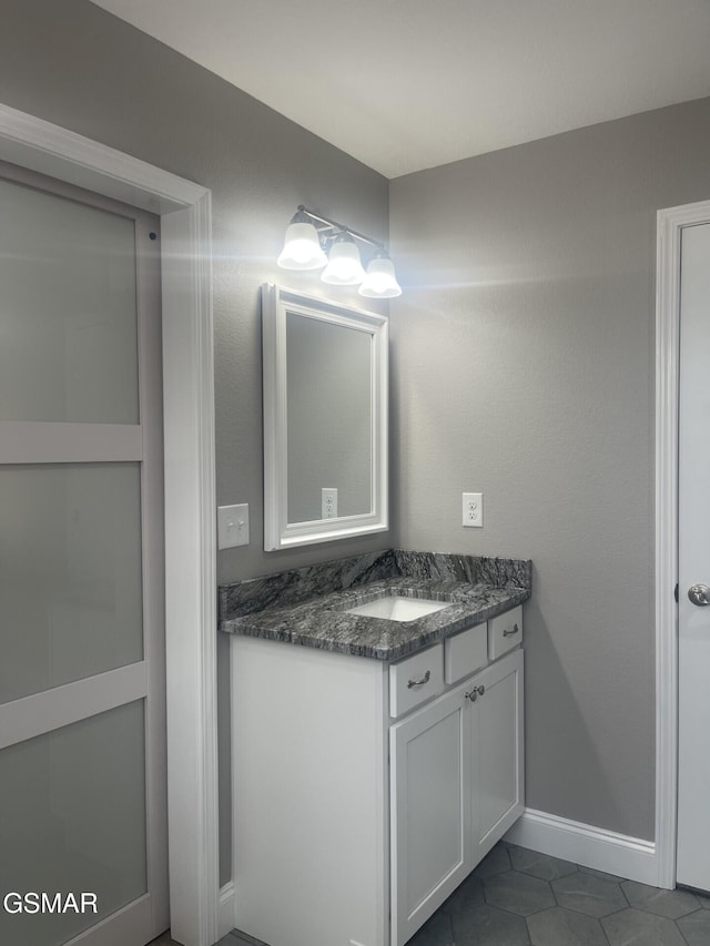 bathroom featuring vanity and tile patterned flooring