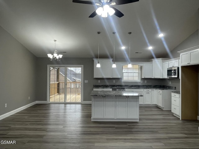 kitchen featuring lofted ceiling, dark hardwood / wood-style floors, and white cabinets