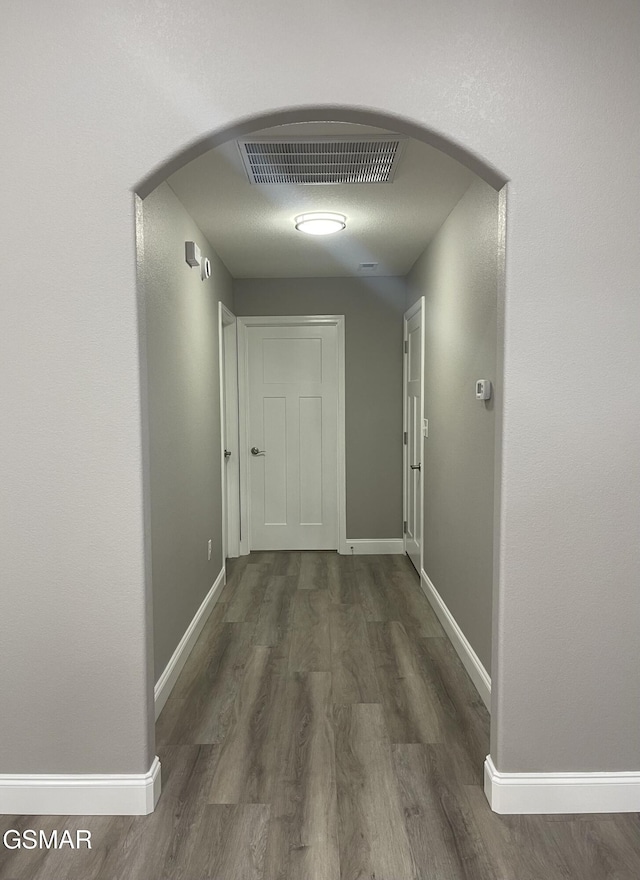 hallway featuring dark wood-type flooring