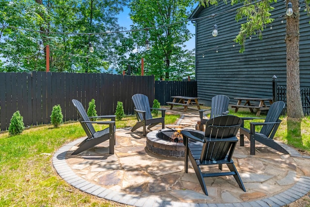 view of patio with an outdoor fire pit