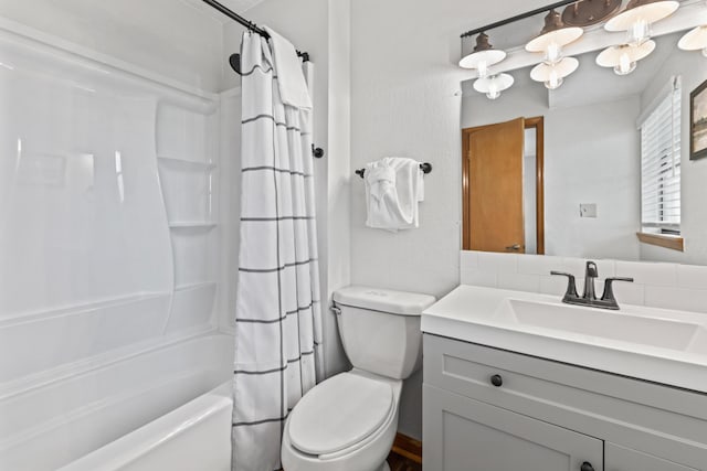 full bathroom with vanity, toilet, and shower / bath combo with shower curtain