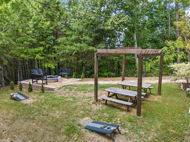 view of yard with an outdoor fire pit and a pergola