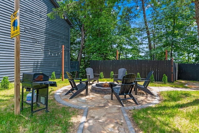 view of patio featuring an outdoor fire pit and area for grilling