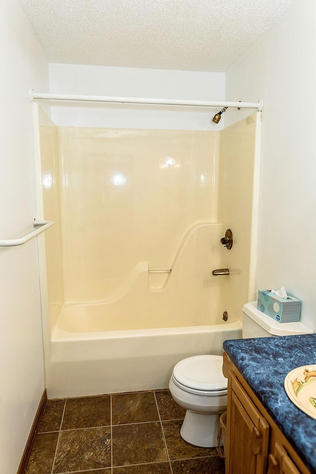 bathroom featuring toilet, tub / shower combination, a textured ceiling, and vanity