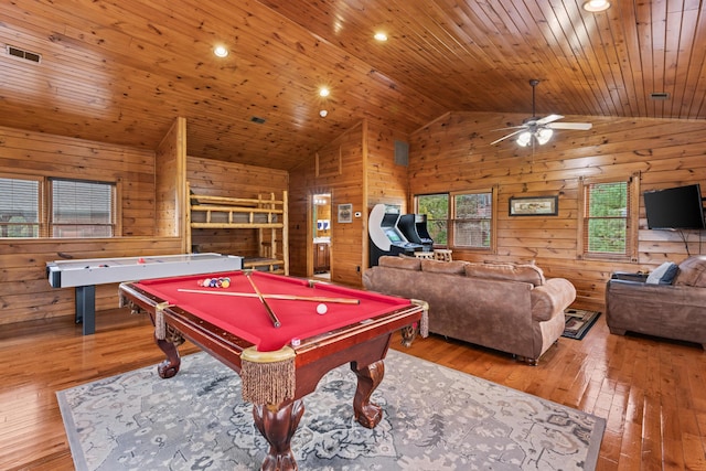 rec room featuring wooden walls, light hardwood / wood-style flooring, lofted ceiling, and billiards