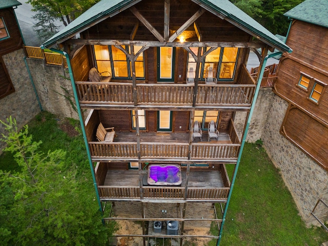 back of house with a balcony