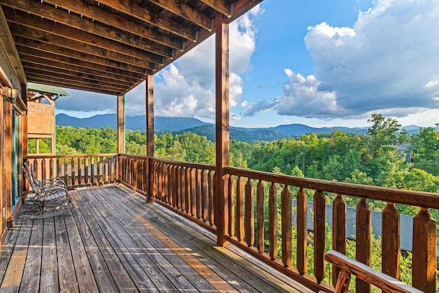 wooden deck featuring a mountain view