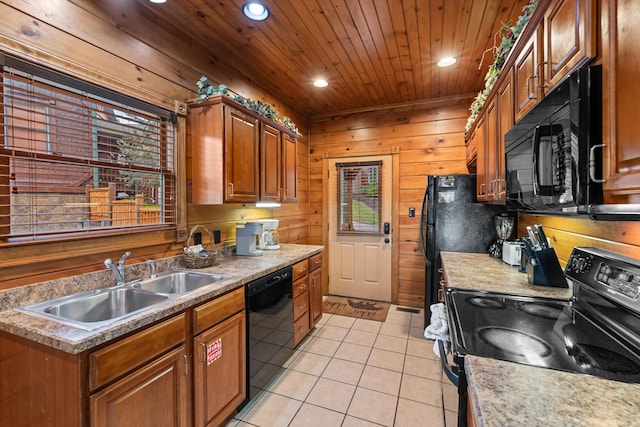 kitchen with black appliances, sink, wooden walls, light tile patterned floors, and wood ceiling