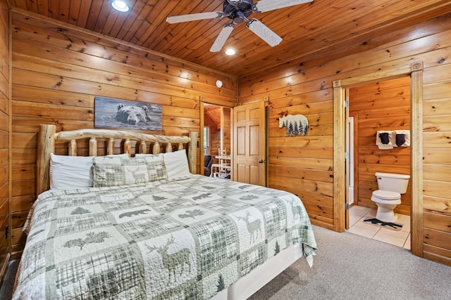 bedroom with ensuite bath, ceiling fan, wooden ceiling, wood walls, and carpet floors