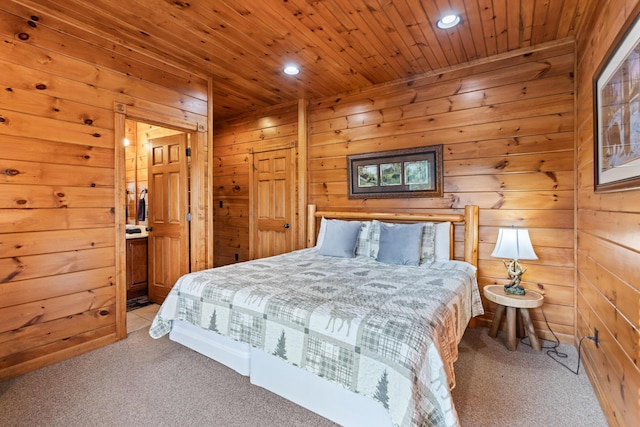 carpeted bedroom featuring wood walls and wooden ceiling