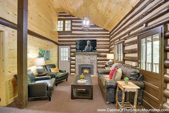 carpeted living room featuring wood walls, high vaulted ceiling, and wooden ceiling