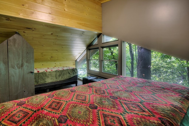 bedroom with wooden ceiling, wooden walls, and vaulted ceiling