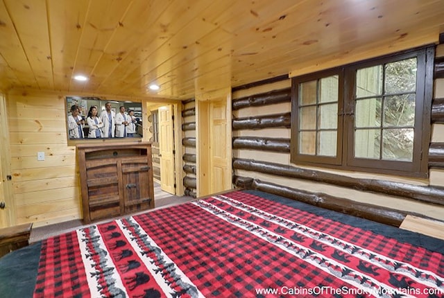 unfurnished bedroom featuring carpet flooring, wooden ceiling, and wooden walls