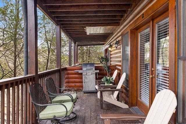 wooden terrace featuring grilling area